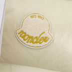 Cream padded vest with oval embroidered 'Moncler' logo patch in gold