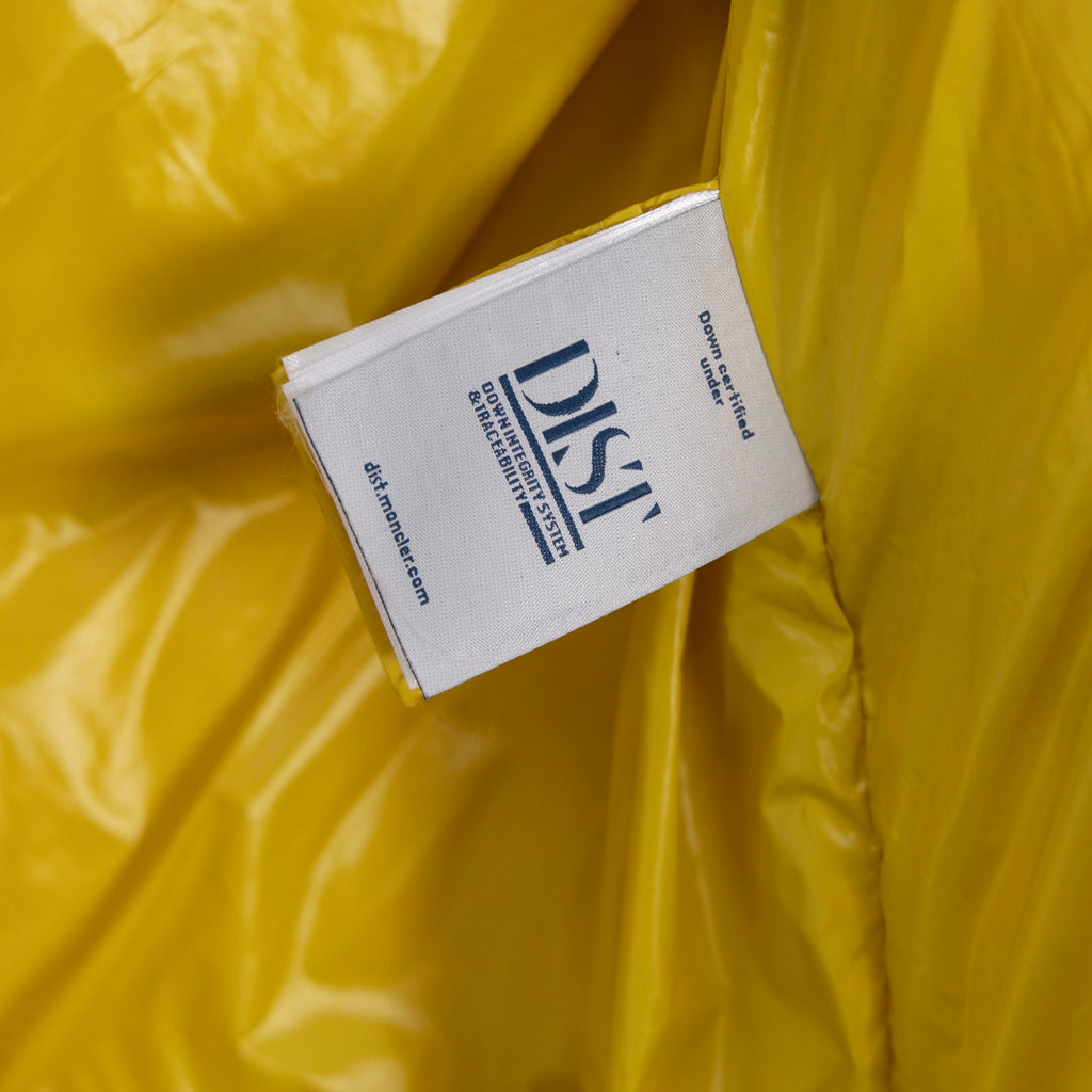 Yellow inner lining fabric with white care/size label card