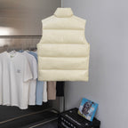 Cream padded vest with stand collar and horizontal baffles, full-length zipper