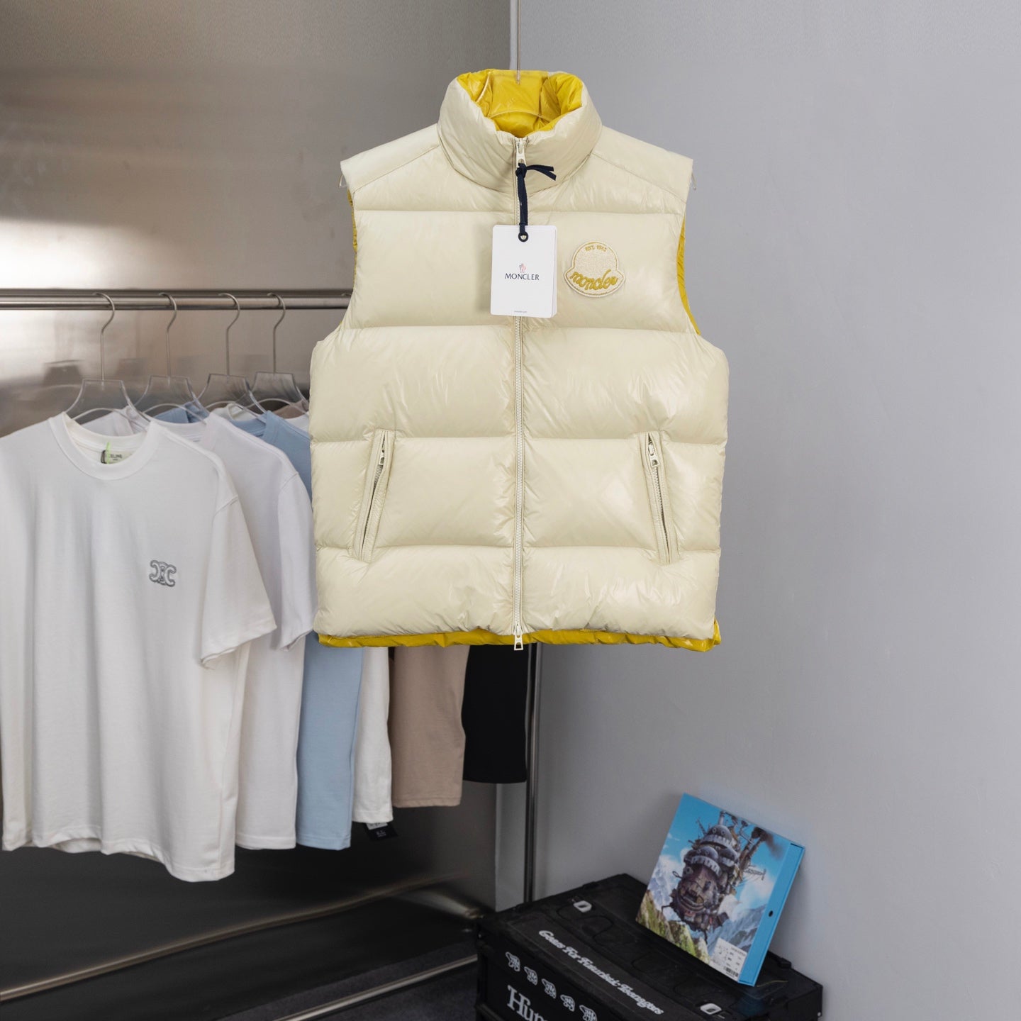 Moncler long padded vest with full front zipper, cream exterior and stand collar