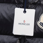 Moncler white garment tag on black puffer jacket fabric