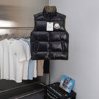 Moncler black puffer vest with high collar and front zip closure