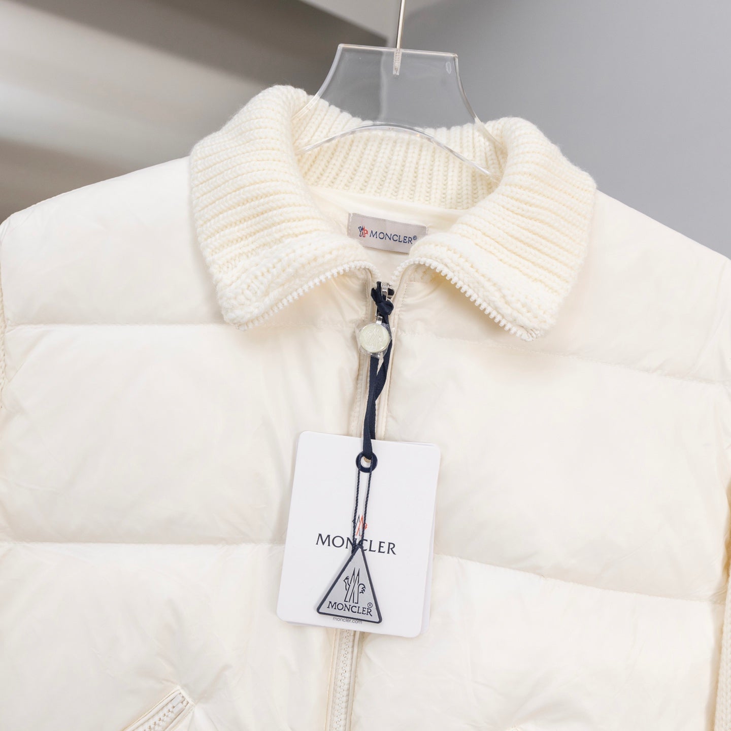 Cream Moncler long puffer jacket with ribbed knit collar and front zipper
