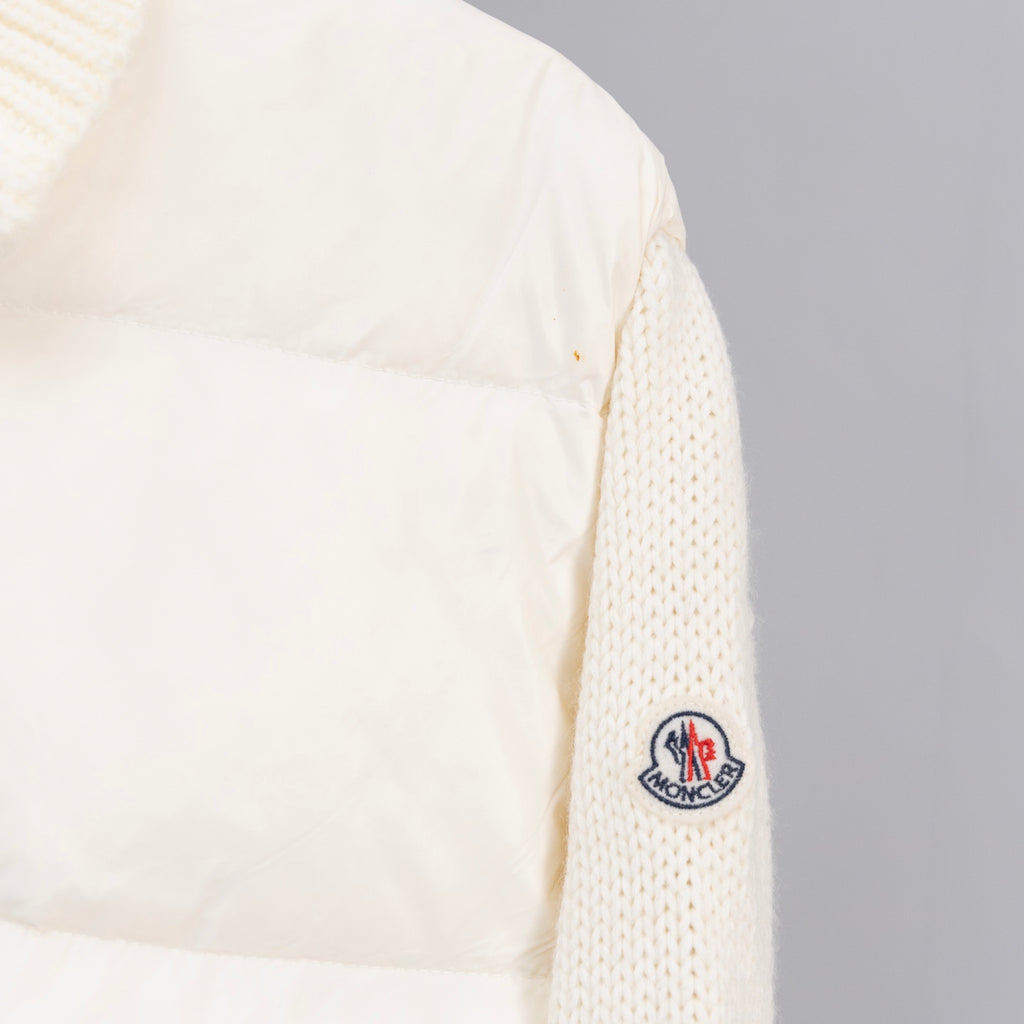 Cream puffer jacket sleeve with Moncler logo patch and knit cuff trim