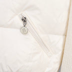 Moncler quilted jacket zipper close-up with metal pull and stitched track