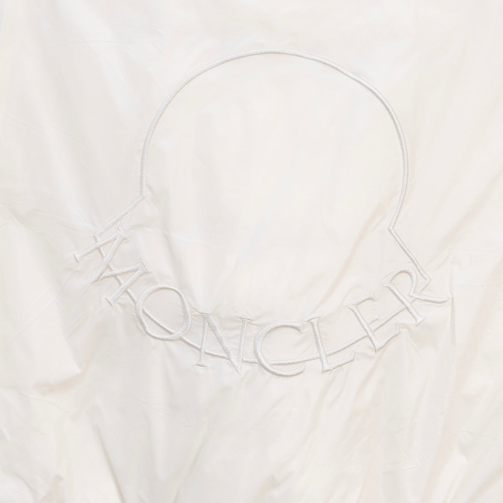 Moncler white puffer jacket, embroidered Moncler-style lettering at neckline