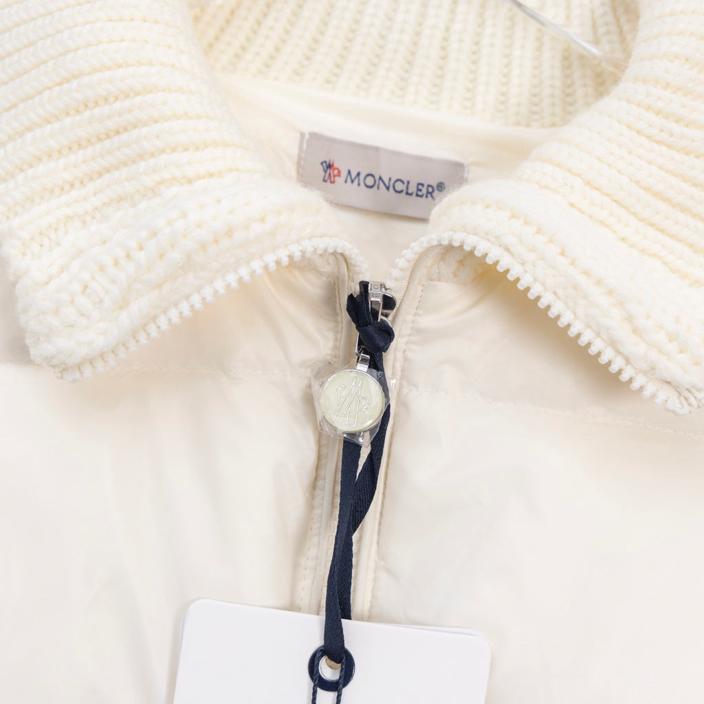 Moncler long puffer jacket close-up of front zipper and knit trim collar