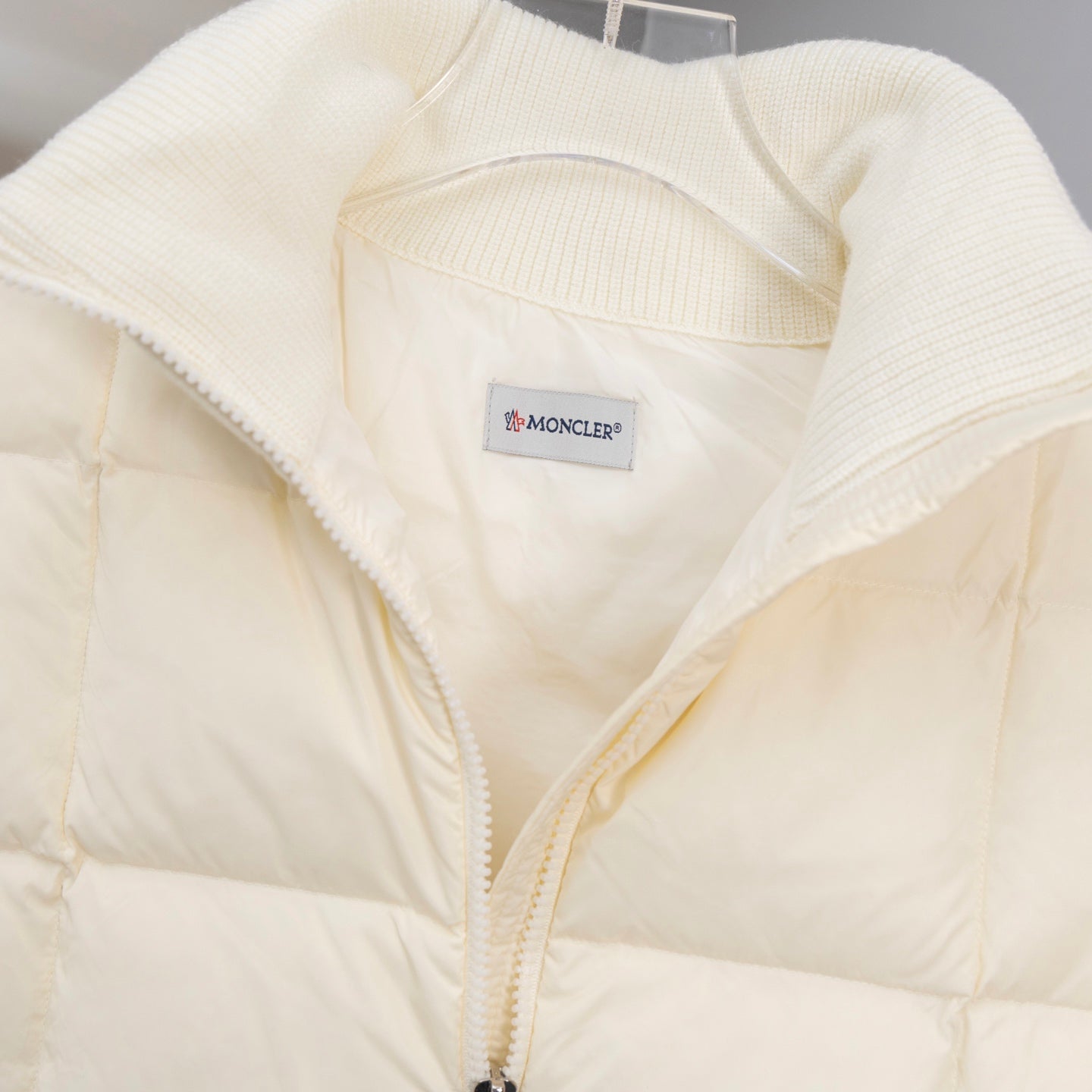 Moncler quilted puffer jacket interior, cream lining with Moncler logo patch