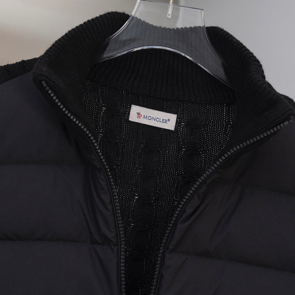 Moncler puffer jacket front close-up with zip and Moncler logo patch label
