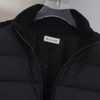 Moncler puffer jacket front close-up with zip and Moncler logo patch label