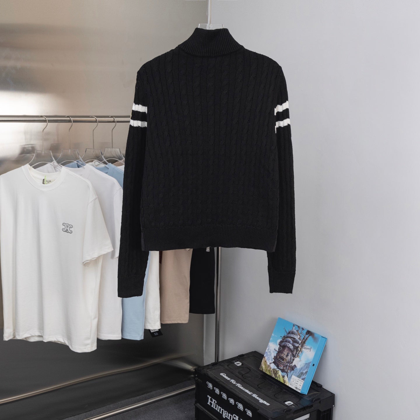 Moncler puffer jacket back view with ribbed turtleneck and striped knit cuffs