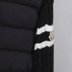 Moncler puffer jacket sleeve with striped knit cuff and round logo patch