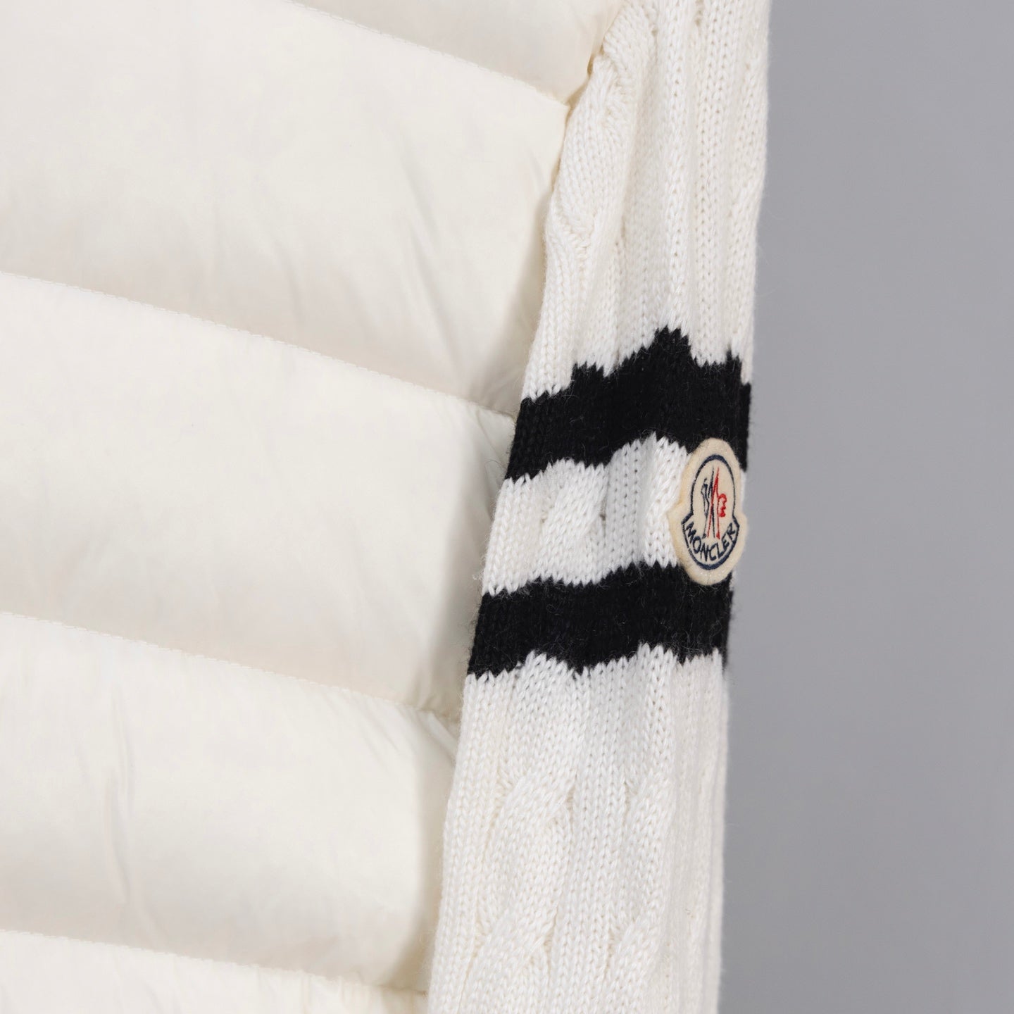 Moncler long puffer jacket sleeve, white knit with black stripe and crest patch