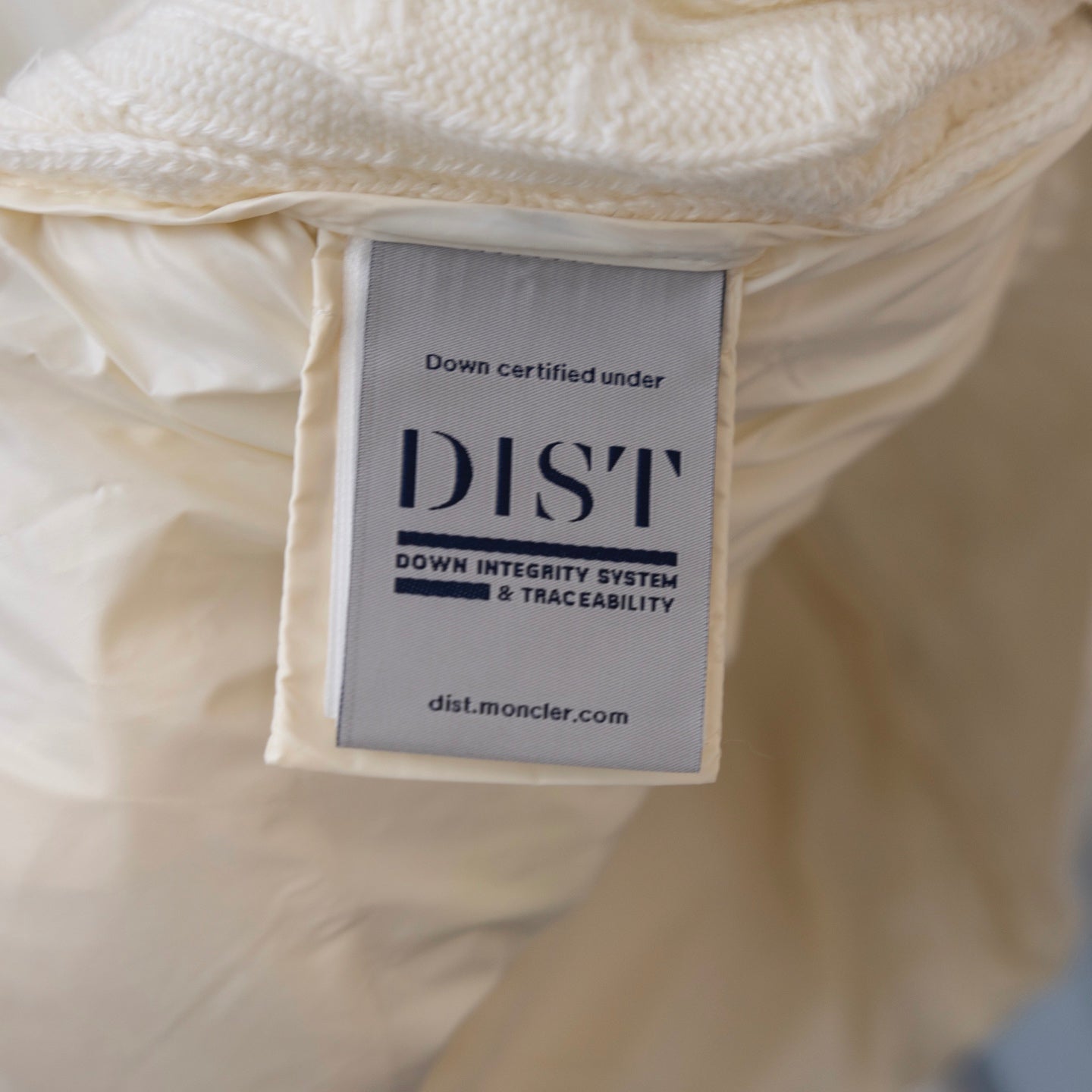 Moncler down label inside puffer jacket, DISI down integrity certification