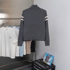 Moncler long puffer jacket back view, ribbed knit collar and striped sleeves