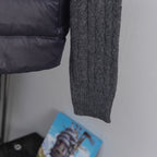 Long dark puffer jacket with gray ribbed knit section