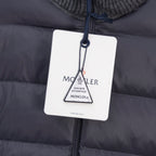 Moncler puffer jacket with hanging authenticity tag attached to front zip