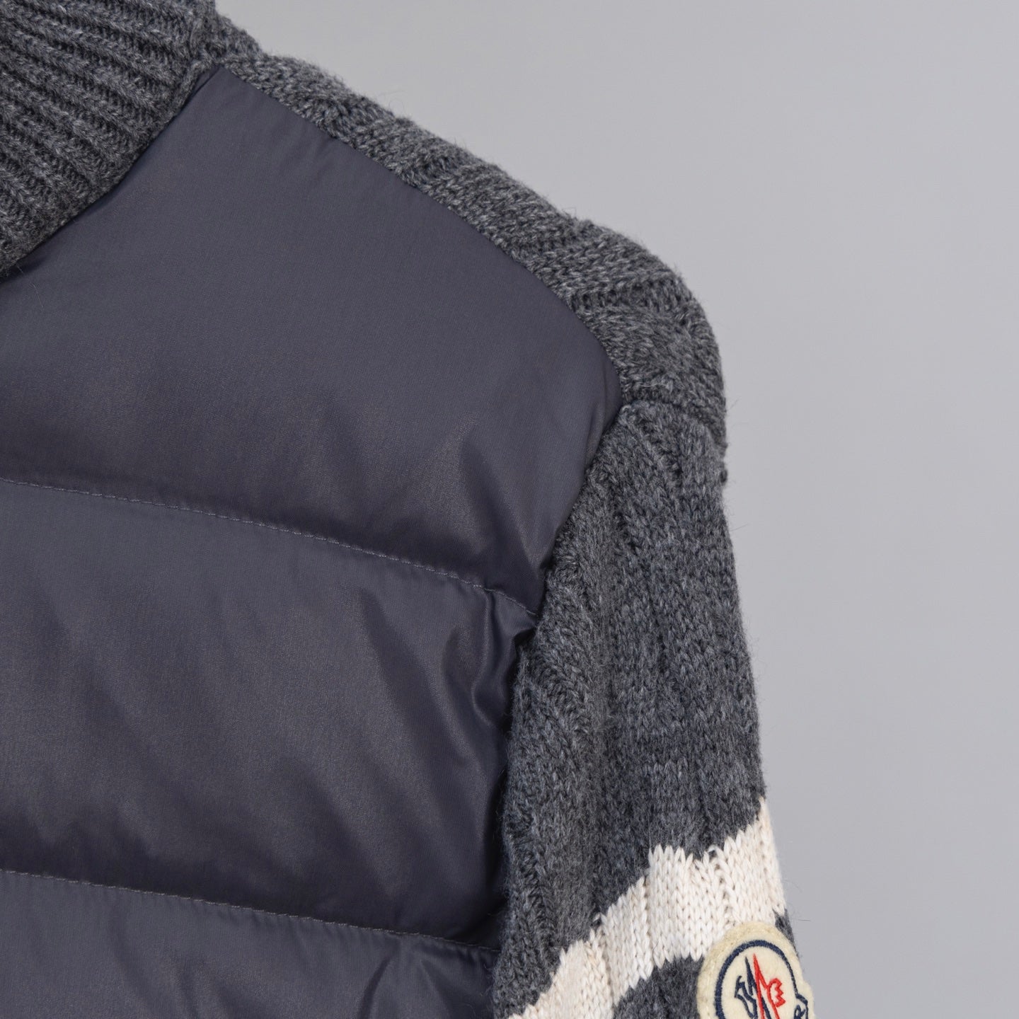 Moncler knit cuff with white stripe on dark puffer side panel