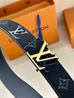 Louis Vuitton belt detail: navy strap with monogram print and gold-tone LV buckle