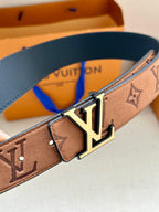 Tan monogram belt with gold LV buckle and blue inner strap