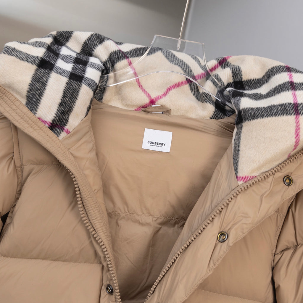 Beige puffer jacket hood with plaid lining trim and Burberry tag