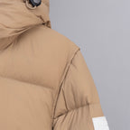Beige puffer jacket shoulder seam detail with Burberry label