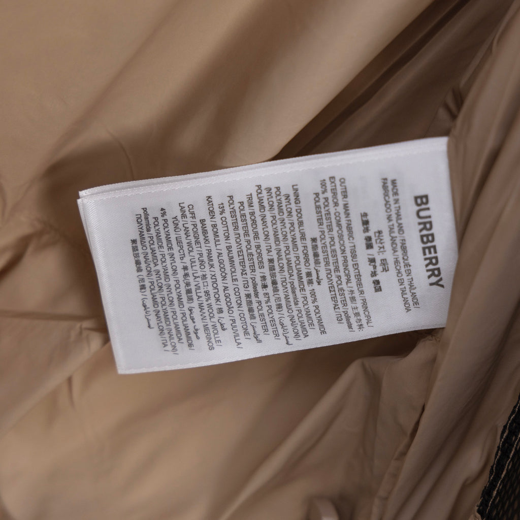 Beige puffer jacket with Burberry care label sewn on inside