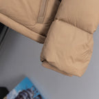 Beige puffer jacket hem with ribbed cuff and quilted panels