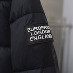 Black puffer jacket with rectangular Burberry London England logo patch