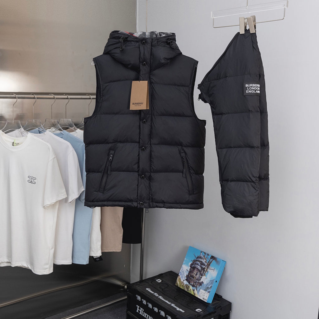 Hooded long puffer jacket in black, front view with matching hooded back piece