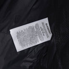 Burberry fabric care label inside dark puffer jacket lining