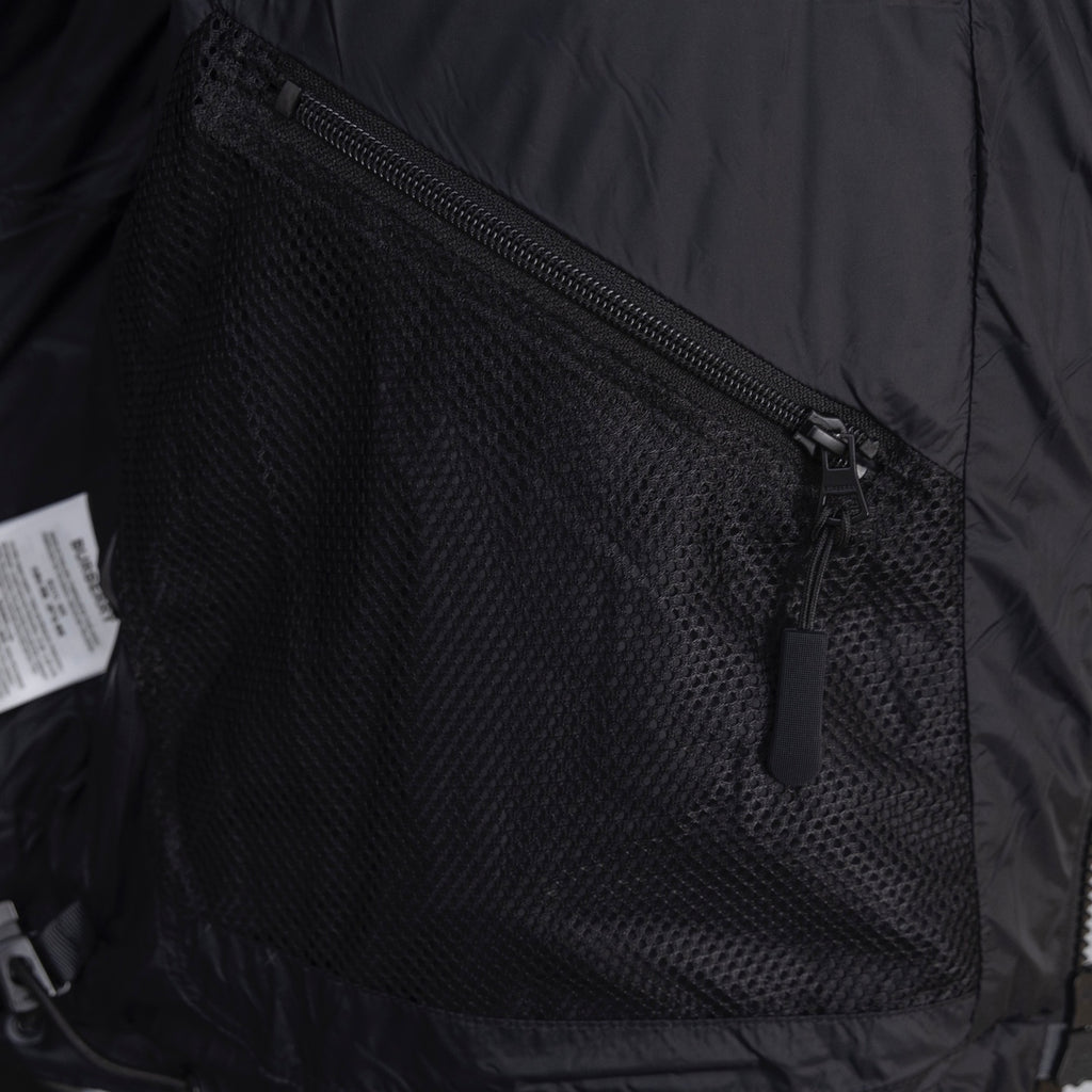 Dark jacket lining with mesh pocket and zip closure