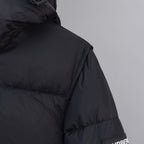 Dark puffer jacket with stitched paneling and high collar