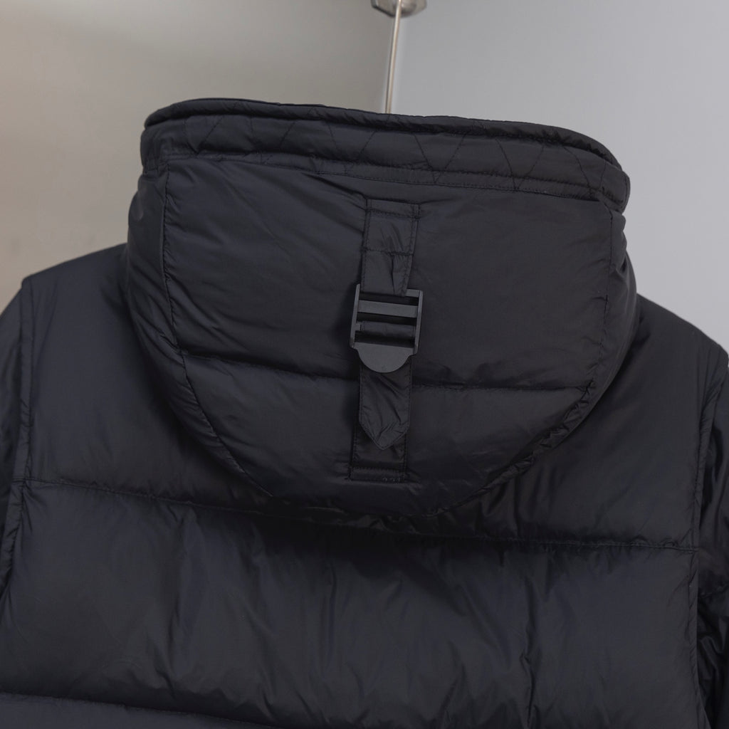 Dark puffer hooded jacket with adjustable strap and front toggle buckle