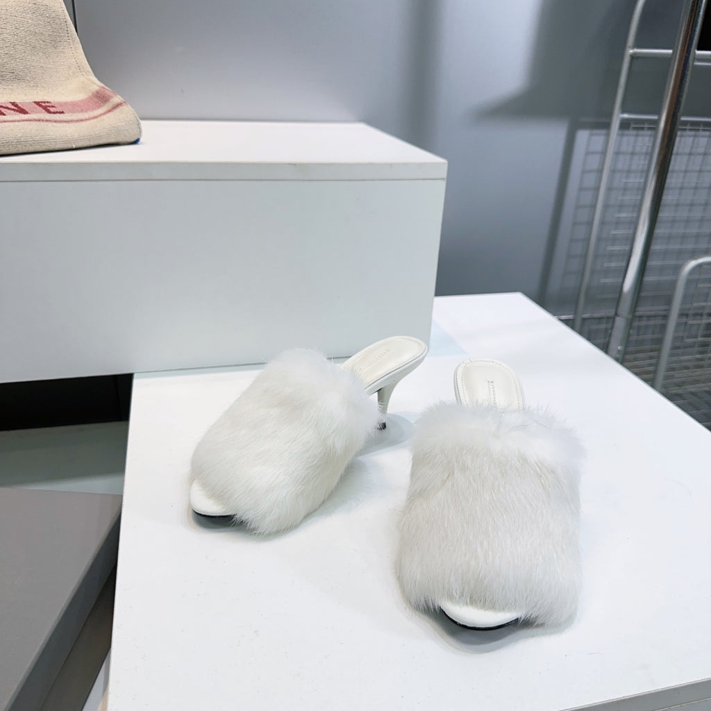 Balenciaga white faux fur slide sandals with low heel and thick fuzzy strap