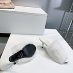 Balenciaga white faux fur slide sandal with low stiletto heel and black sole