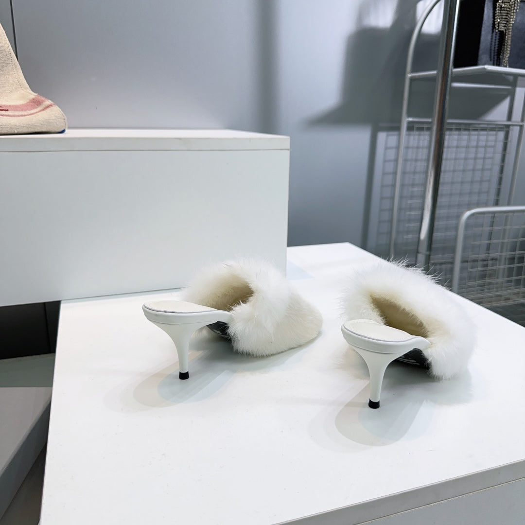 Balenciaga white faux fur slide sandals with curved straps and low stiletto heels