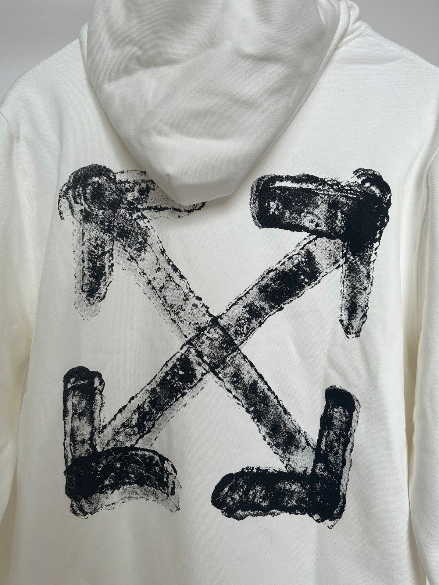 Off-white hoodie close-up of large black X graphic on the back