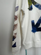 Off-White hoodie side view with blue-and-tan graphic sleeve print