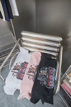Light pink and black Louis Vuitton short-sleeve T-shirts with graphic prints