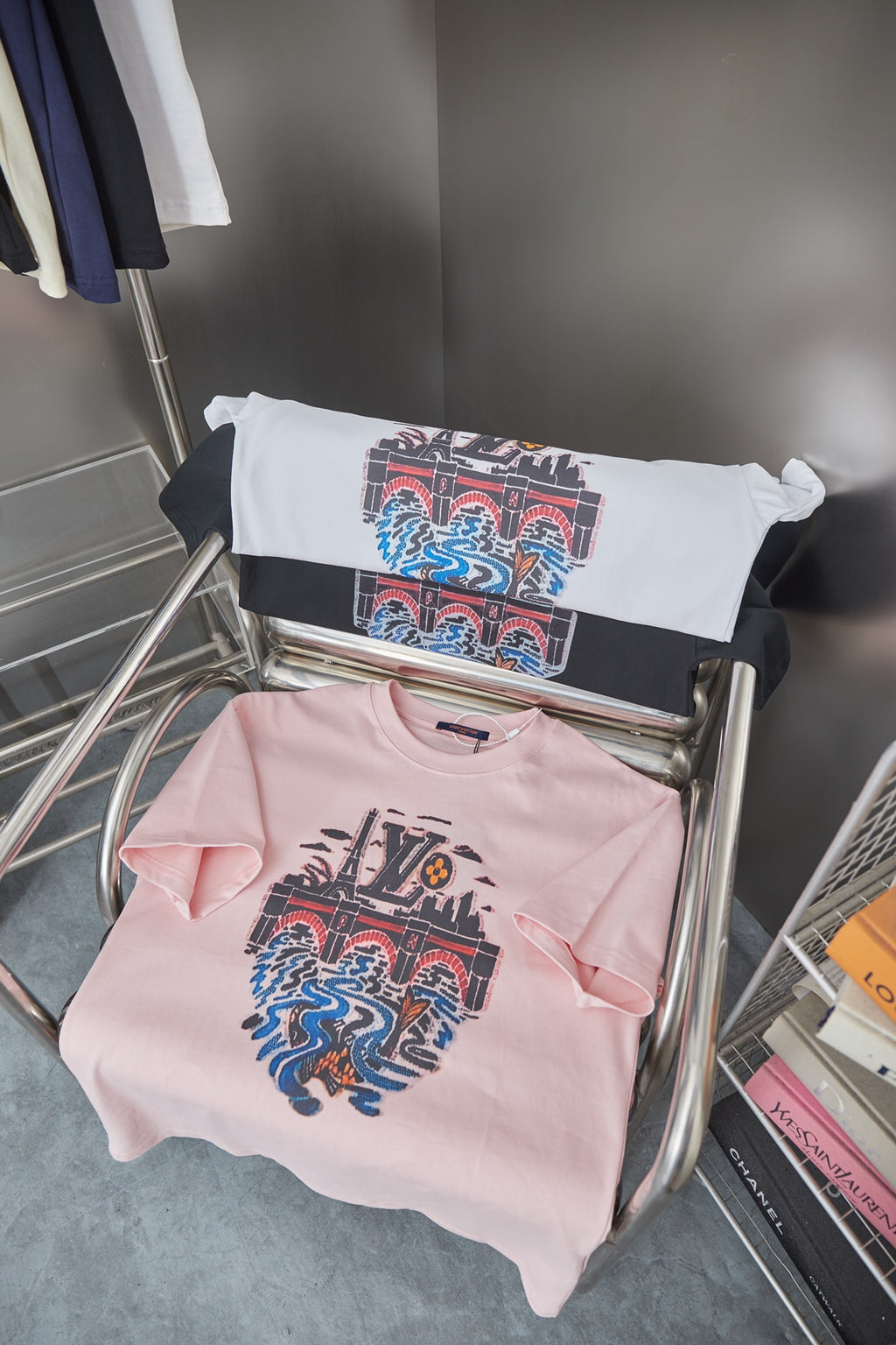 Stack of light pink and white Louis Vuitton short-sleeve T-shirts with graphic prints