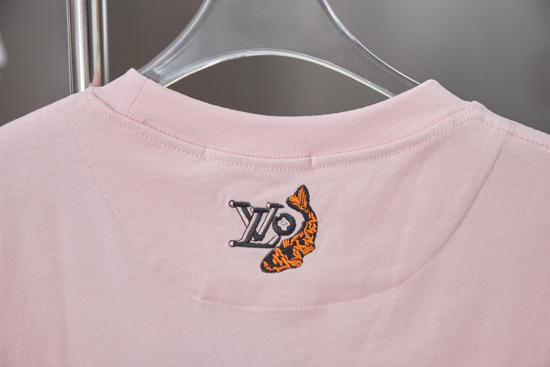 Light pink T-shirt back with small multicolor emblem near neckline