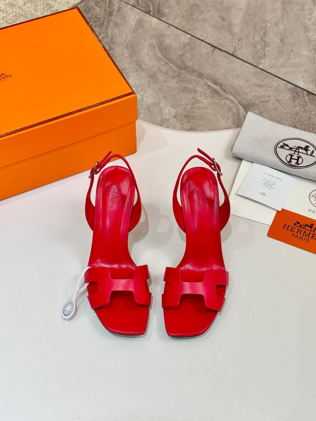 Hermes red open-toe high-heel slingback sandals, outsole and heel view