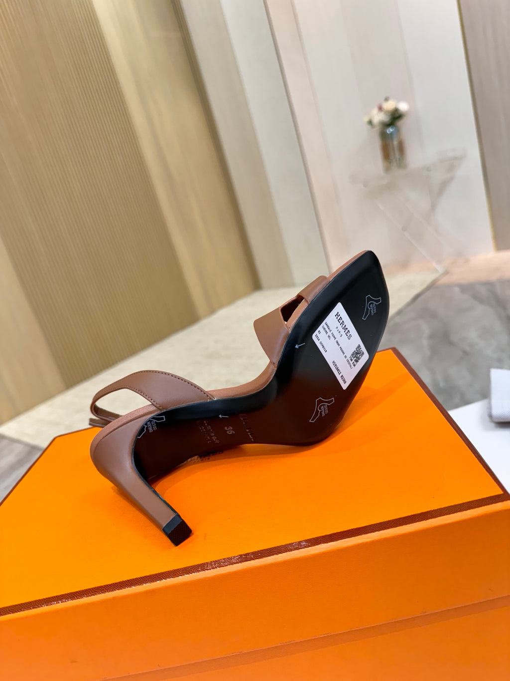 Hermes women’s leather heeled sandals, tan upper with black sole and open toe