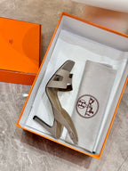 Hermes heeled sandals in light gray leather with slingback ankle strap