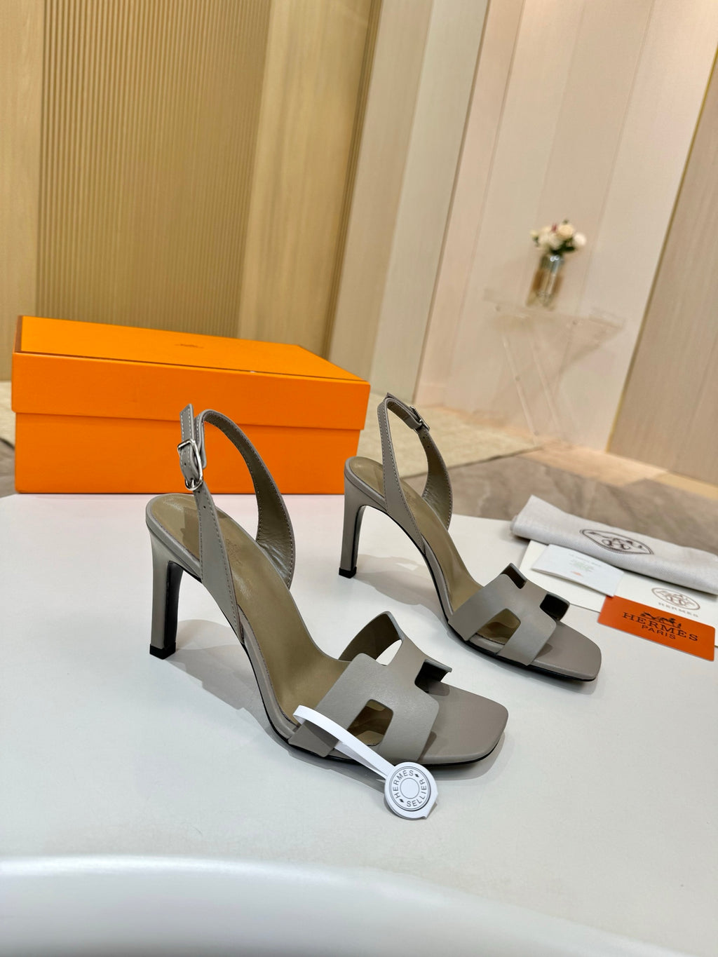Hermes heeled sandals, light gray leather, cross strap over foot and sculpted block heel