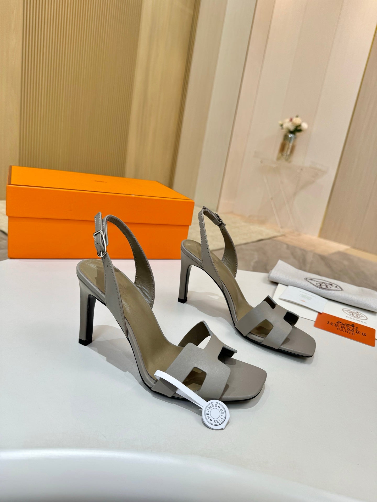 Hermes heeled sandals, light gray leather, cross strap over foot and sculpted block heel