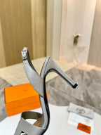 Hermes heeled sandal in light gray leather with slingback strap and low block heel