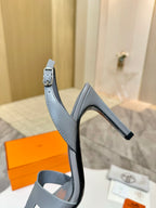 Light blue-gray leather heeled sandal with T-strap and ankle strap