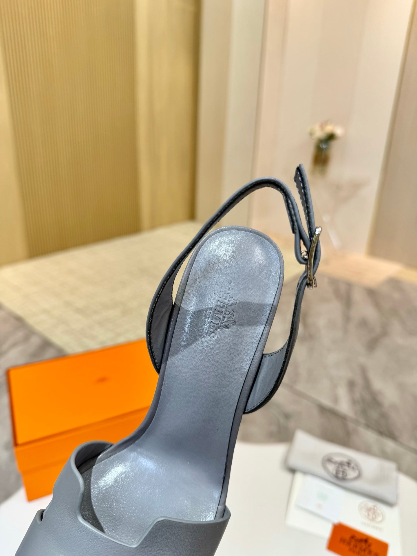 Light blue-gray heeled sandal with slingback strap and rounded open toe